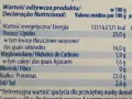 Tabela wartości odżywczych sera halloumi: 321 kcal, 25g tłuszczu, 1,6g cukru, 22g białka na 100g.